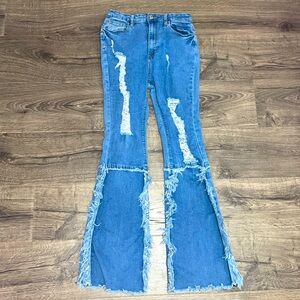 Frayed flare bell bottom ripped blue jeans